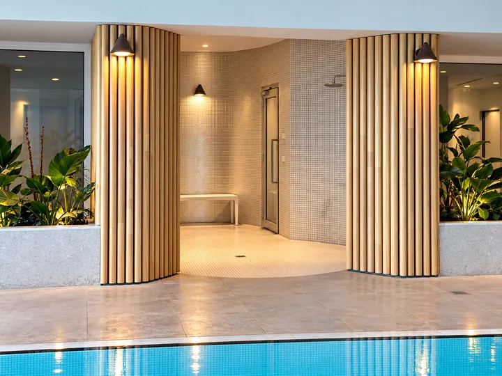 Shared poolside shower and steam-room entrance
